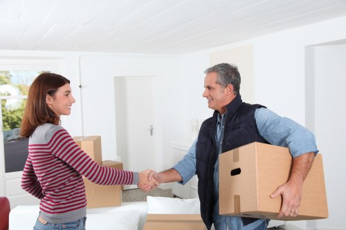 Local removals team handling furniture loading for a Shooters Hill move